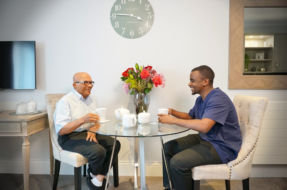 Signature team member chatting with a resident