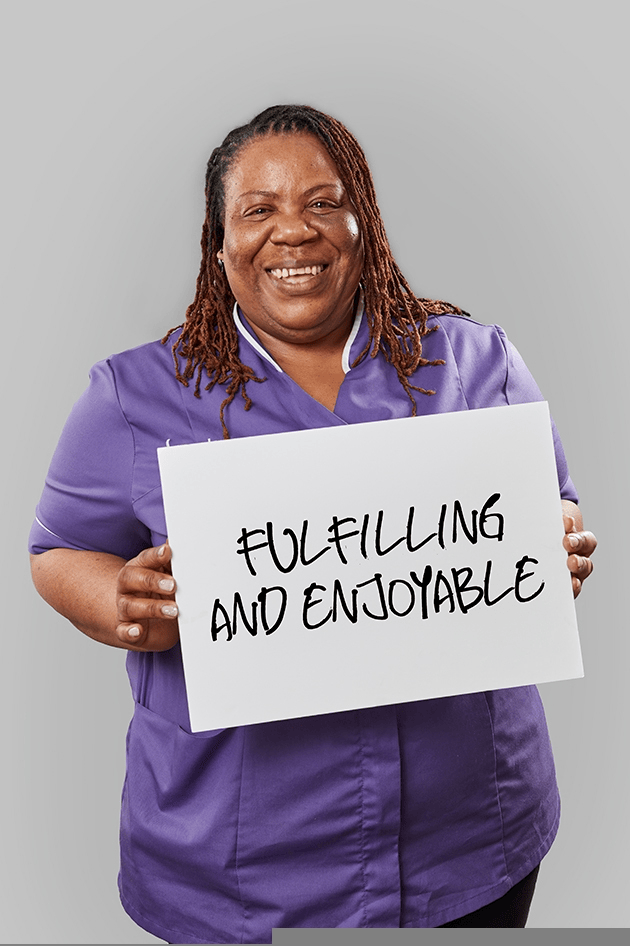 Signature team member holding a Fulfilling and enjoyable sign